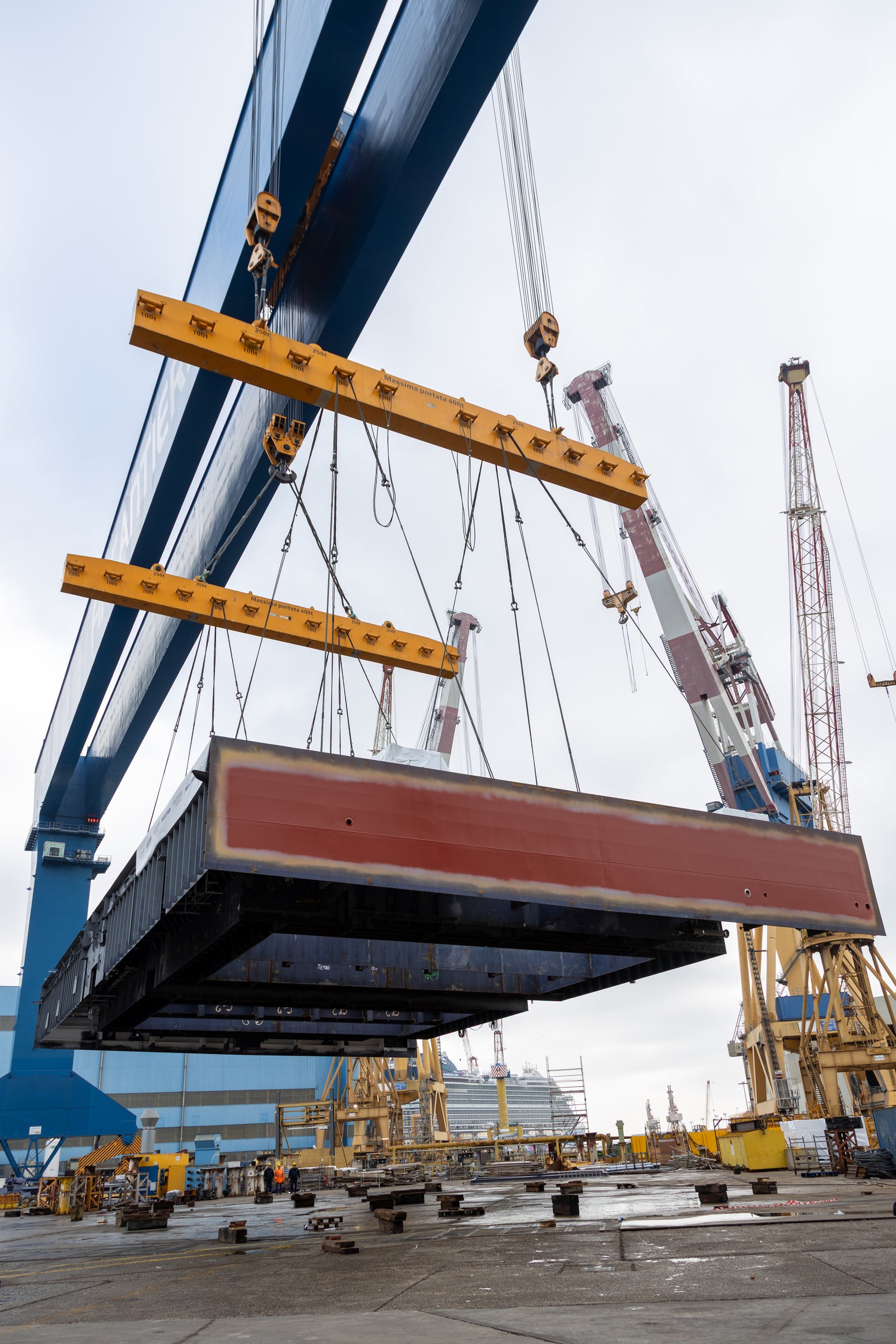 Newsroom - Press releases - 2026 - Fincantieri Group: keel laying of oceania sonata in marghera: first hull section of oceania sonata lifted by cranes and yellow spreaders at marghera shipyard.