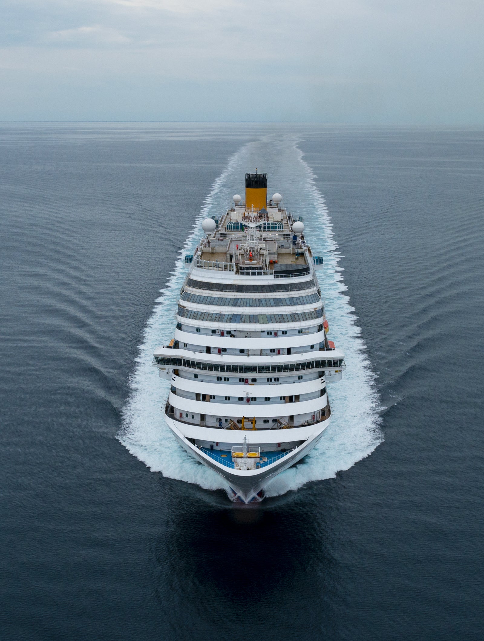 Fincantieri | Group - Business - Products - Cruise Ships - Costa Diadema: Front view of Costa Diadema cruise ship in operation, visible wake, hull with multiple passenger decks.