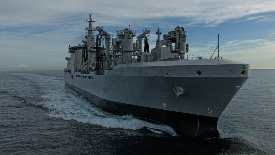newsroom - press releases - 2025 - fincantieri group: fincantieri delivers "atlante", second lss unit for the italian navy: lss military support vessel "atlante" sailing on the open sea, bow view with refueling systems and wake behind.