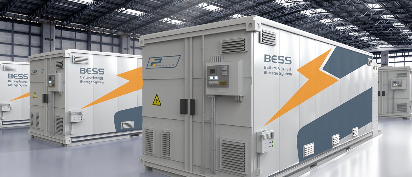 Fincantieri | Group - Subsidiaries and Affiliates - Power4Future: Battery Energy Storage Systems (BESS) units displayed in a spacious industrial warehouse; modern design with control panels and prominent orange lightning bolt graphic, text ‘BESS’ and ‘Battery Energy Storage System’ clearly visible; well-lit environment with clean, organized layout.