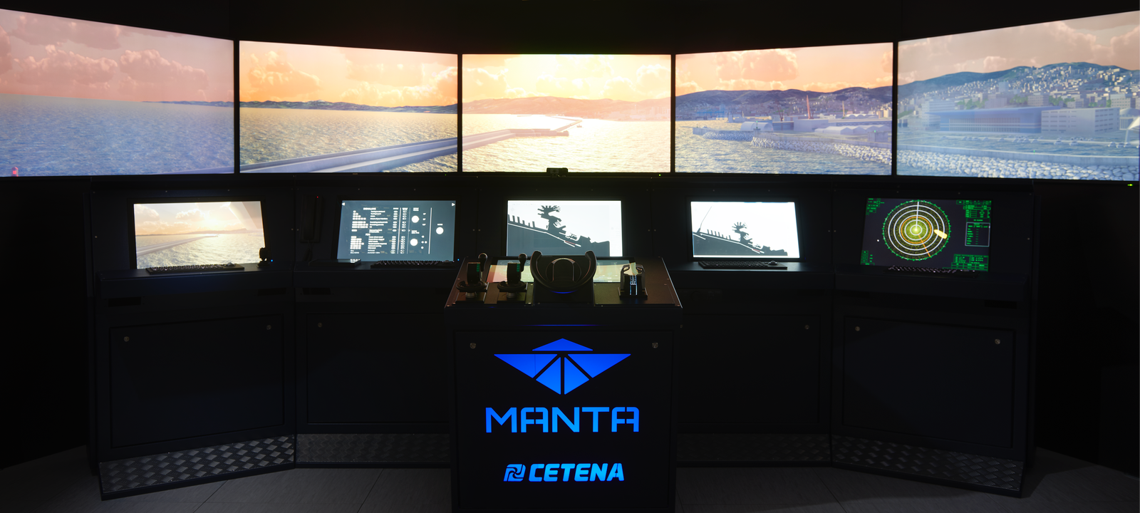 Fincantieri | Group - Subsidiaries and Affiliates - Fincantieri NextTech: MANTA simulation system by CETENA featuring multiple screens displaying oceanic and coastal visuals, central console with control panels and radar interfaces for maritime training or navigation simulation, 'MANTA' and 'CETENA' logo prominently visible on the station.