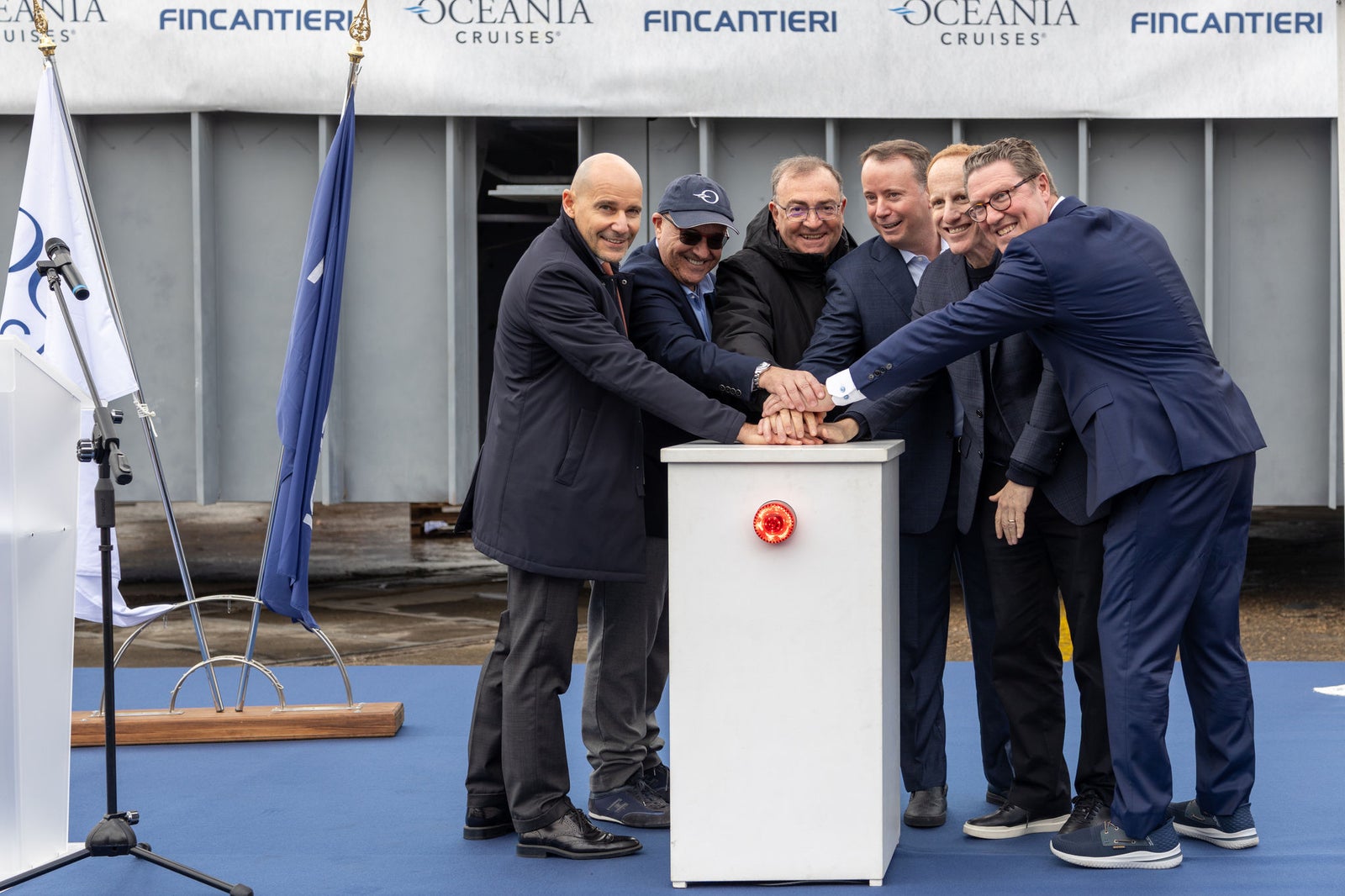 Newsroom - Press releases - 2026 - Fincantieri Group: keel laying of oceania sonata in marghera: executives from fincantieri and oceania cruises press the ceremonial button together during keel laying event.
