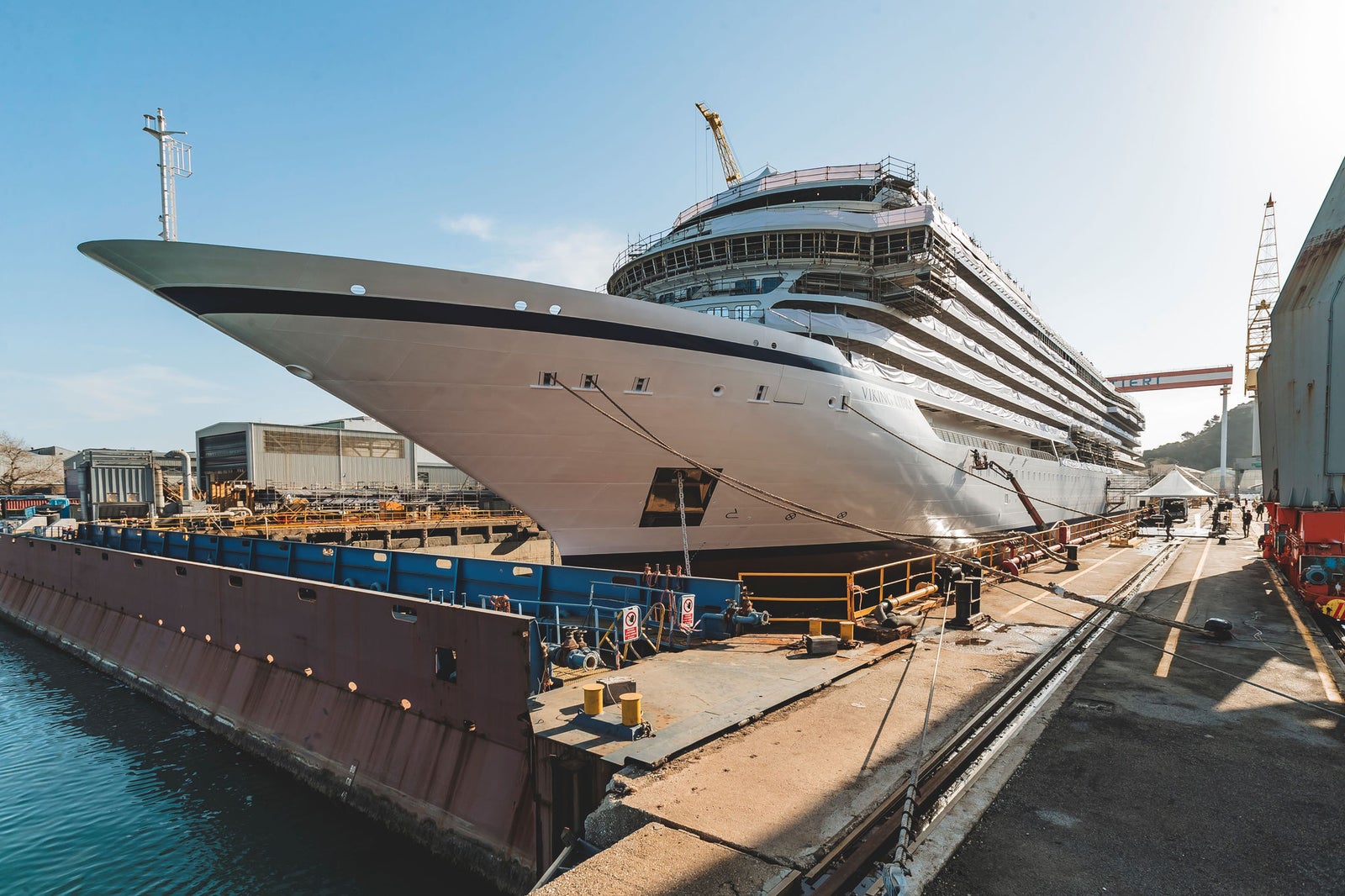 Newsroom - Press releases - 2026 - Fincantieri Group: Fincantieri: “Viking Libra” launched in Ancona, the world’s first hydrogen-powered cruise ship: Viking Libra hydrogen-powered cruise ship docked at the Ancona shipyard, bow view with cranes and scaffolding.