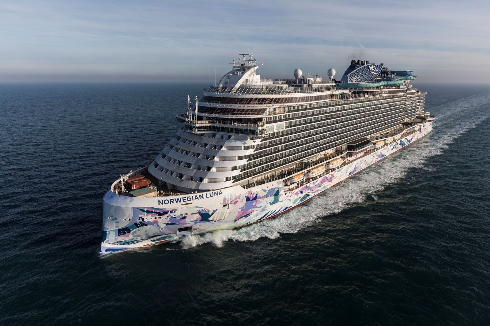 Newsroom - Press releases - 2026 - Fincantieri Group: Fincantieri delivers Norwegian Luna in Marghera: Norwegian Luna cruise ship sailing at sea, colorful hull livery and upper decks visible, photographed from above.