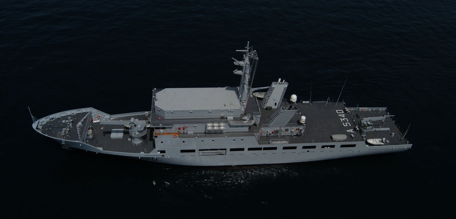 Fincantieri | Group - Business - Products - Specialised Units - Elettra ship: Side view of operational ship underway, flat deck, advanced communication antennas, number 3510 clearly visible on hull.