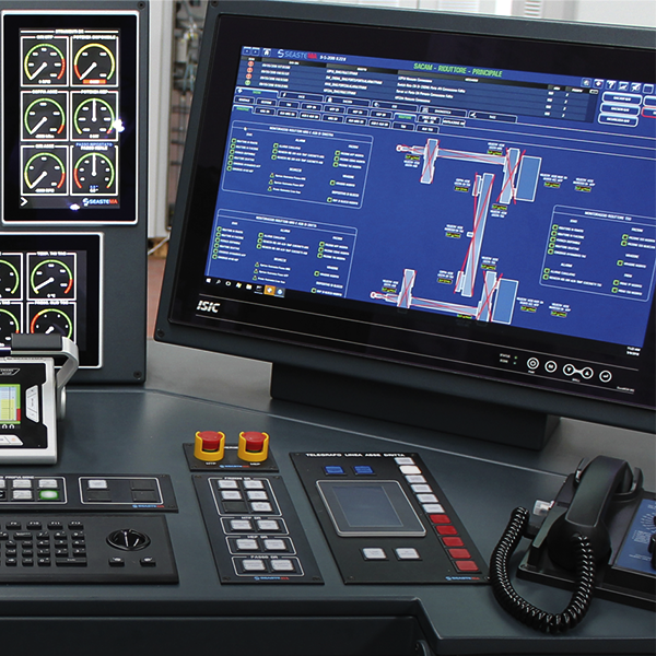 Fincantieri | Group - Business - Products - Telecommunications - Industrial control panel: Industrial control panel with multiple monitoring screens displaying system data and diagrams; gauges, buttons, and telephone included; visible numeric indicators on gauges provide detailed metrics for operational control.