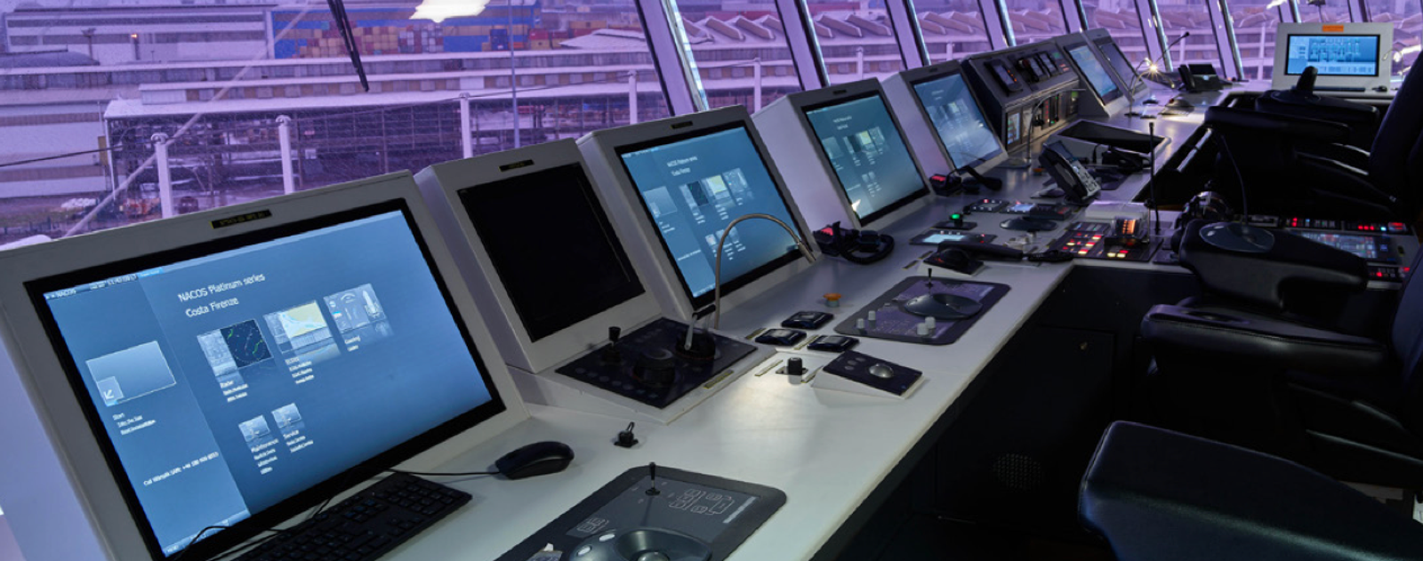 Fincantieri | Group - Sustainability - Responsible Culture - Cybersecurity Management: High-tech ship control room with multiple monitors and command panels, spacious bridge overlooking the port through large windows, screens displaying navigational and operational data, soft purple lighting; professional and technologically advanced atmosphere.