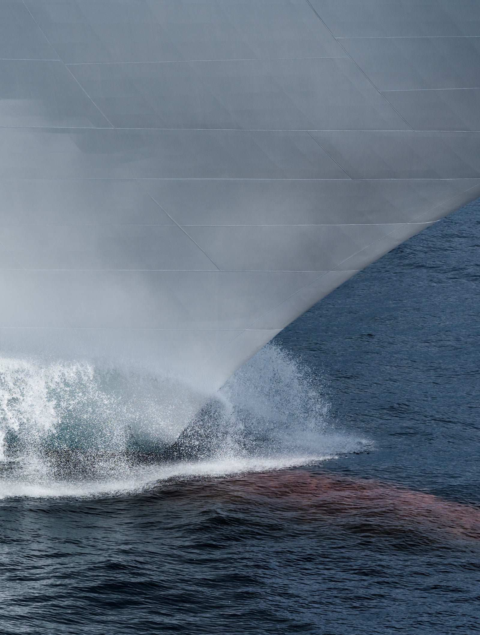 Fincantieri | Group - Business - Products - Cruise Ships - Seabourn Ovation: Close-up of expedition ship Seabourn Ovation bow in operation, number '5' visible on hull, choppy water.