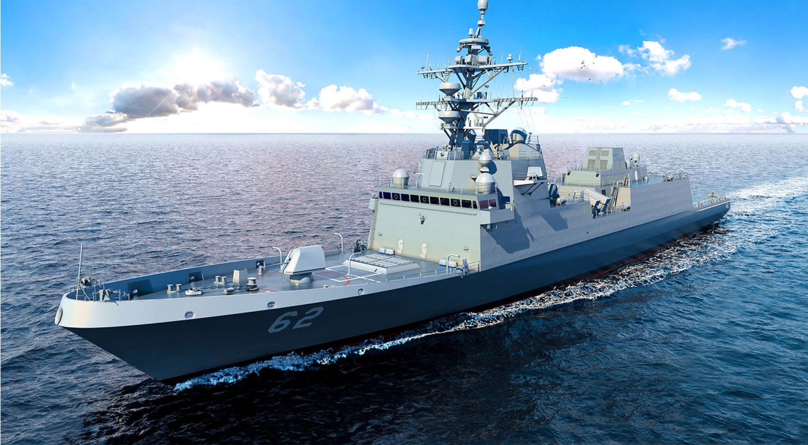 Fincantieri | Gruppo - Società - Controllate e collegate - Fincantieri Marine Group: Nave da guerra moderna operativa in navigazione su acque calme sotto cielo blu luminoso, dotata di sistemi radar avanzati e armamenti, numero ‘62’ ben visibile sullo scafo; enfasi su tecnologia marittima e capacità di difesa in ambiente sereno.