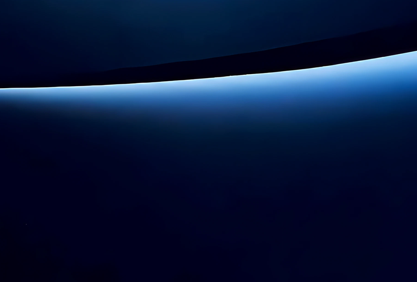Fincantieri | Group - Governance and Ethics - Internal Control and Risk Management System: Dark blue background with a bright blue curve at the top casting light onto the darker background.