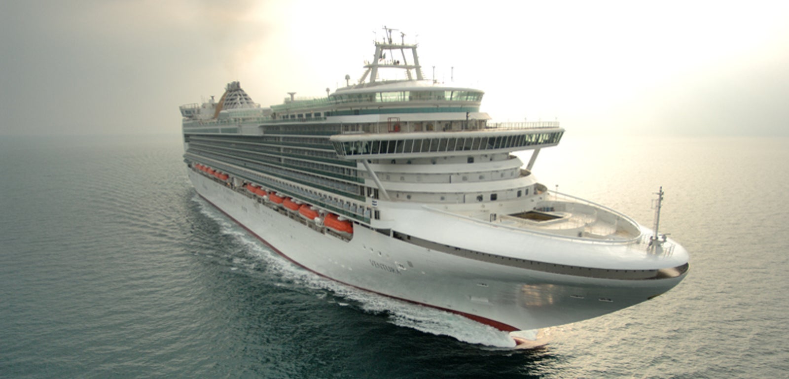 Fincantieri | Group - Business - Products - Cruise Ships - Ventura: View of Ventura cruise ship in operation navigating open sea, hull with multiple passenger decks, visible lifeboats and Ventura name readable on hull.