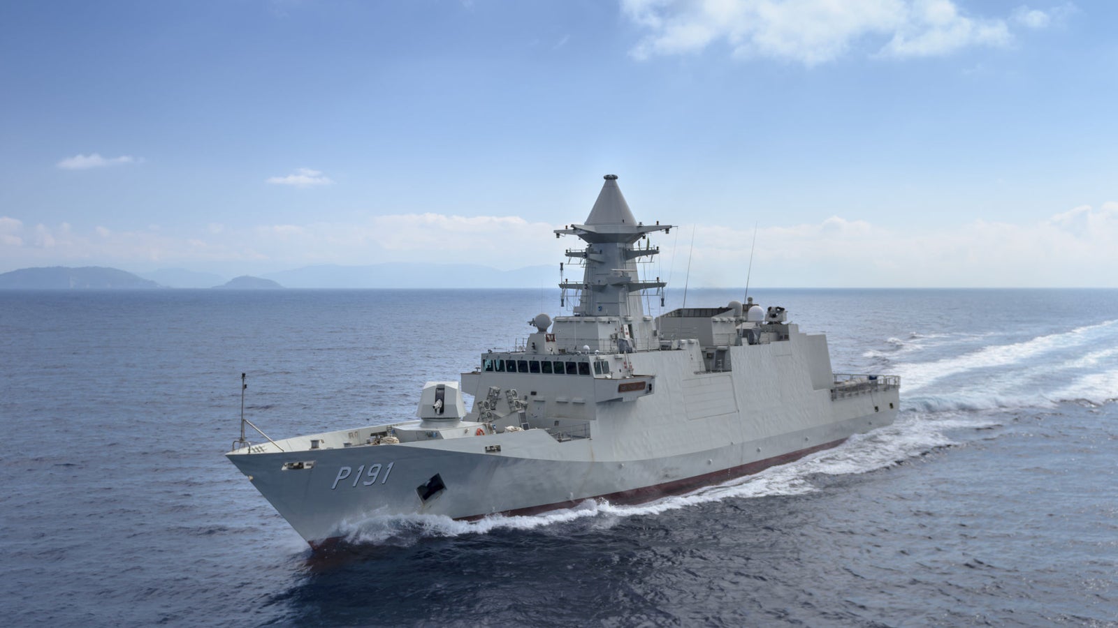 Fincantieri | Group - Business - Products - Defence Vessels - Corvettes - Abu Dhabi class: Side view of operational ship underway, modern design, advanced radar systems, number P191 clearly visible on hull.