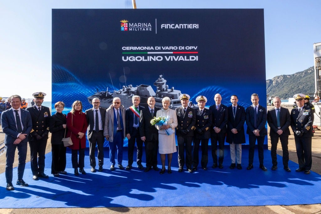 Newsroom - Press releases - 2026 - Fincantieri Group: launch of the first next-generation offshore patrol vessel for the Italian Navy: authorities, management and navy officers pose in front of event panel for ugolino vivaldi launch ceremony.
