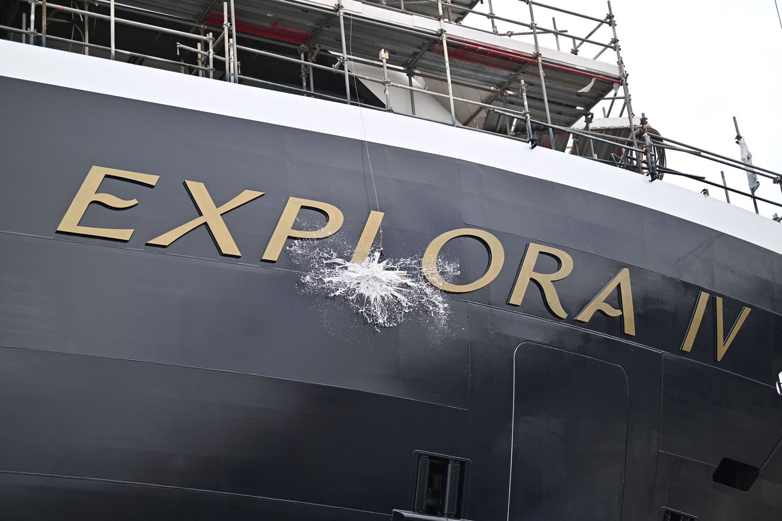 Newsroom - Press releases - 2026 - Fincantieri Group: Fincantieri:  Today triple ceremony for Fincantieri and Explora Journeys at Sestri Ponente: launche of Explora IV, coin ceremony for Explora V and steel cuttingfor Explora VI: Champagne bottle breaks against the hull of Explora IV during launching ceremony, with ship’s name visible.