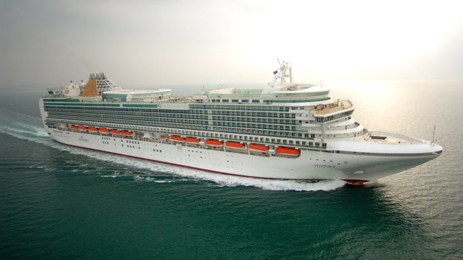 Fincantieri | Group - Business - Products - Cruise Ships - Ventura: Side view of Ventura cruise ship in operation navigating open sea, white hull with multiple passenger decks and visible lifeboats along sides.